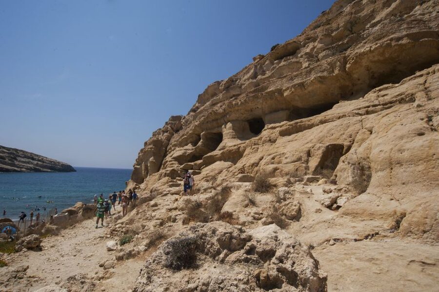 Crete: Matala Beach and Hippie caves, Red beach - Getting there from many pickup points, what the bus experience feels like