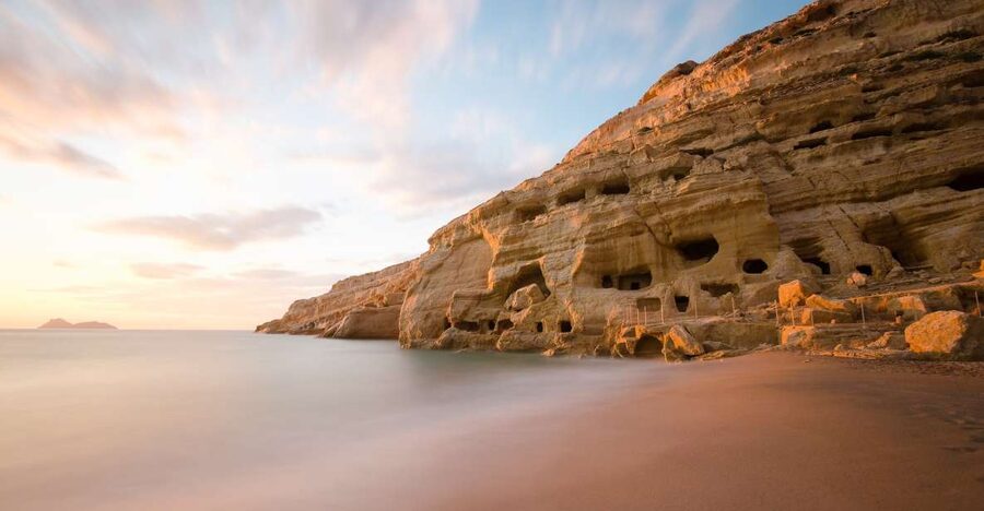 Crete: Matala Beach and Hippie caves, Red beach - Hippie caves in Matala, tomb origins plus 1960s life