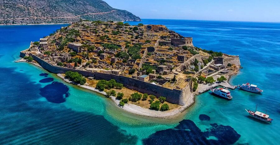 Crete: Spinalonga, Elounda, & Agios Nikolaos Boat Tour & BBQ - Kolokytha Beach and the on-board BBQ on Mirabello Bay