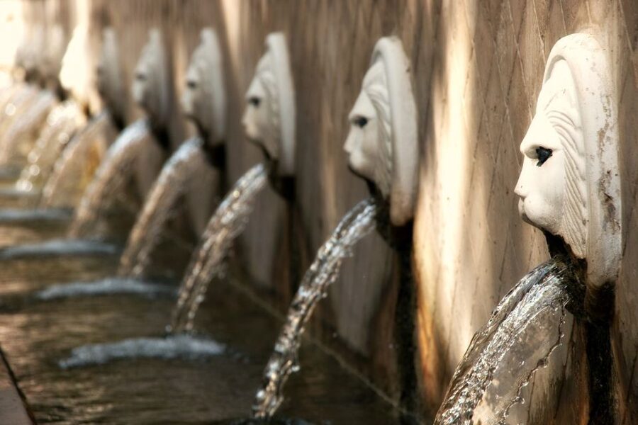 From Rethymno private full day tour to the south - Spili Village: Lion Head Fountains, Shade, and a Quick Lesson on Cretan Life