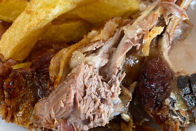 Gastronomy tour and wine tasting in traditional villages - Dinner back in Apokoronas: grape-juice chicken, smoked pork, and beer-marinated mushrooms