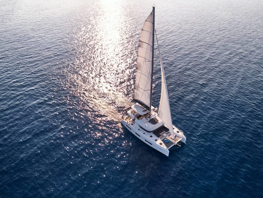 Heraklion: Dia Island Luxury Catamaran Cruise with Meal - Dia Island at anchor, swimming and snorkeling with gear included